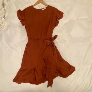 Shiny silky copper wrap dress.
